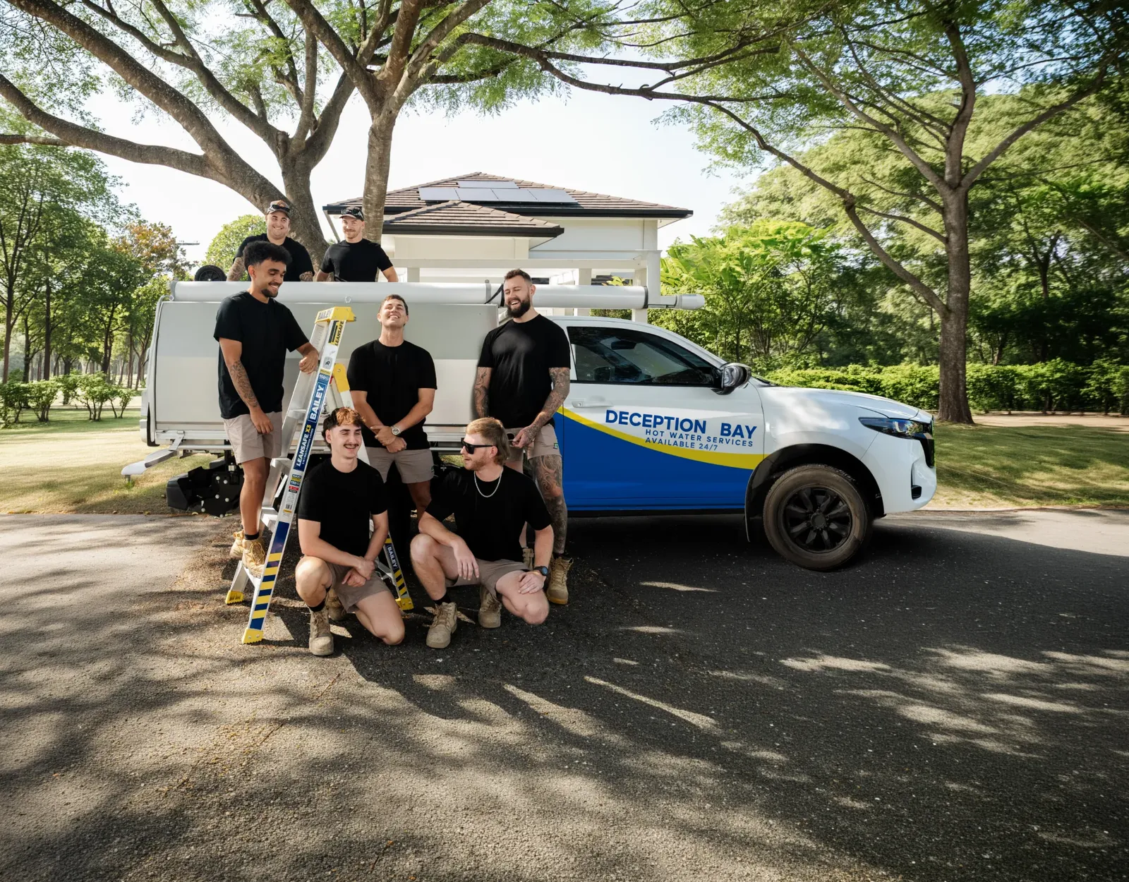Deception Bay Hot Water Services ute and team
